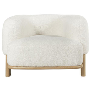  enduring lines that create a welcoming ambiance. Heavily textured upholstery adds neutral allure