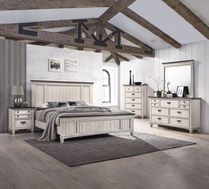 This exquisite bedroom collection epitomizes timeless elegance, with its classic silhouettes and refined antique finish. The bed, distinguished by its beautifully paneled headboard, anchors the space with its traditional charm. An integrated footboard ben