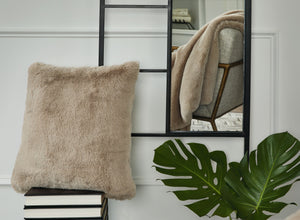  subtle and sensational. The plush feel of this faux rabbit fur pillow will drive you wild. Its taupe hue pairs with a variety of decor