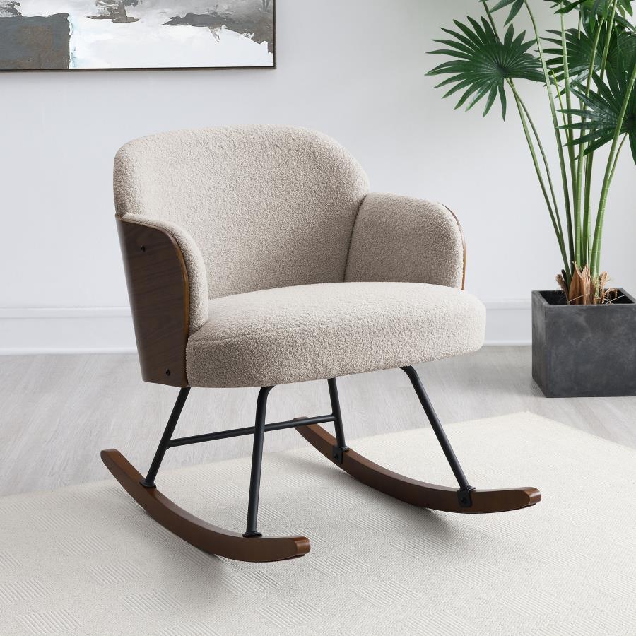 This modern rocking chair blends cozy comfort with sophisticated design, making it an ideal addition to any contemporary home. The plush boucle fabric upholstery wraps the seat and backrest, providing a soft and inviting surface. The walnut-finished bentw