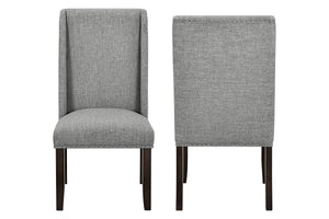 The Faust Upholstered Parsons Dining Chairs combine elegant design with quality construction, making this set of 2 chairs a perfect addition to any dining space. Crafted from solid rubberwood and eco-friendly manufactured woods, these chairs are built to 