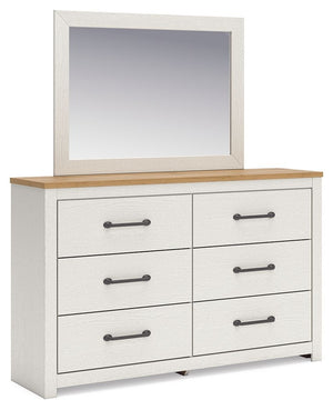 Create a serene countryside retreat with this dresser and mirror set. The two-tone design effortlessly adds farmhouse style, while framed drawer fronts with pewter-tone handles enhance its charming appeal. Looking for furniture that offers storage and a p