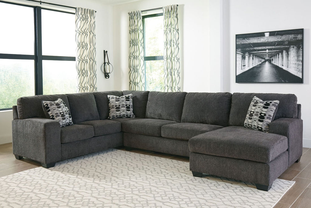 A mastery in less is more, this sectional manages to make cool, contemporary design so warm and cozy. A new twist on neutral, the sectionalâ€™s soothing -"smoky-" gray upholstery is incredibly plush to the touch. Gently rounded corners give the clean-line