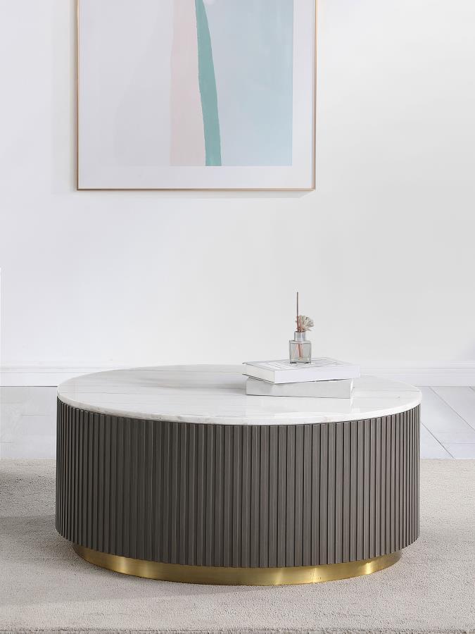 Center your living space with this elegant, modern round coffee table. The genuine white marble top exudes sophistication with its subtle veining, adding organic flair. The clean, light coloration complements any surrounding decor. A ribbed, engineered wo