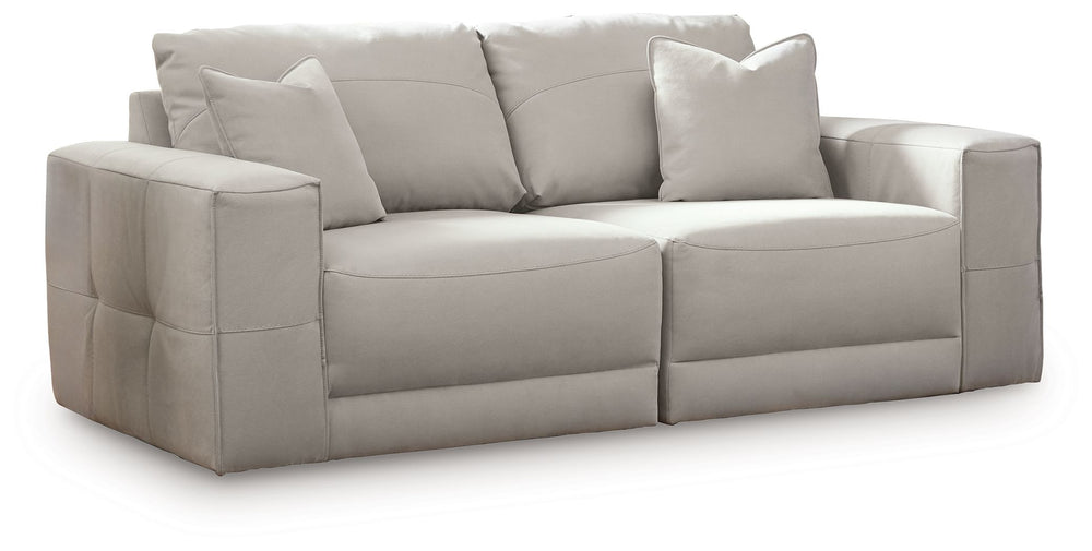 The expansive silhouette of this sectional loveseat invites you to spread out and relax. Upholstered in a durable gray faux leather that captures the look and feel of nubuck leather, this stunning piece envelops you in baby-soft comfort. Its clean modern 