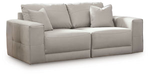 The expansive silhouette of this sectional loveseat invites you to spread out and relax. Upholstered in a durable gray faux leather that captures the look and feel of nubuck leather, this stunning piece envelops you in baby-soft comfort. Its clean modern 