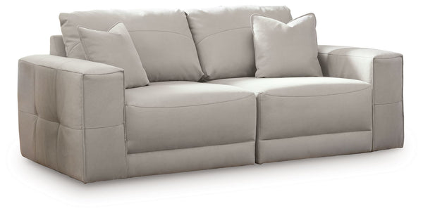 The expansive silhouette of this sectional loveseat invites you to spread out and relax. Upholstered in a durable gray faux leather that captures the look and feel of nubuck leather, this stunning piece envelops you in baby-soft comfort. Its clean modern 