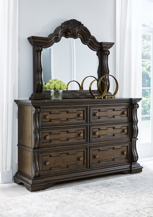  this bedroom collection is nothing short of stunning. A choice blend of materials is accented by detailed ornamental appliques and large-scale decorative scrol