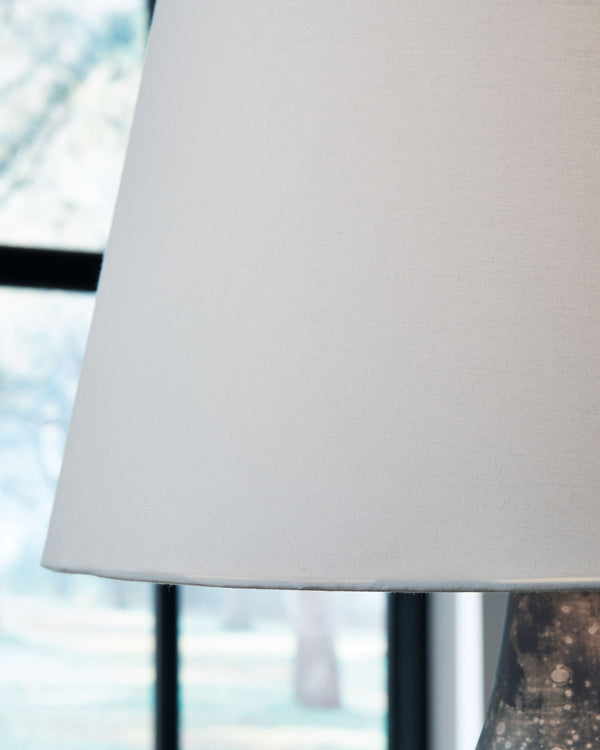  its urn-shaped body and free-form antiqued finish convey a vintage aesthetic. An empire shade enhances the designâ€™s t