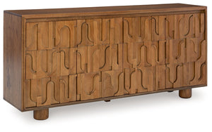 Sure to make a gorgeous statement, this accent cabinet is a work of art. From the geometric cutout pattern on the door fronts to the beautiful honey brown finish, this piece is style and function at its best. Push magnet doors open to reveal two shelves f