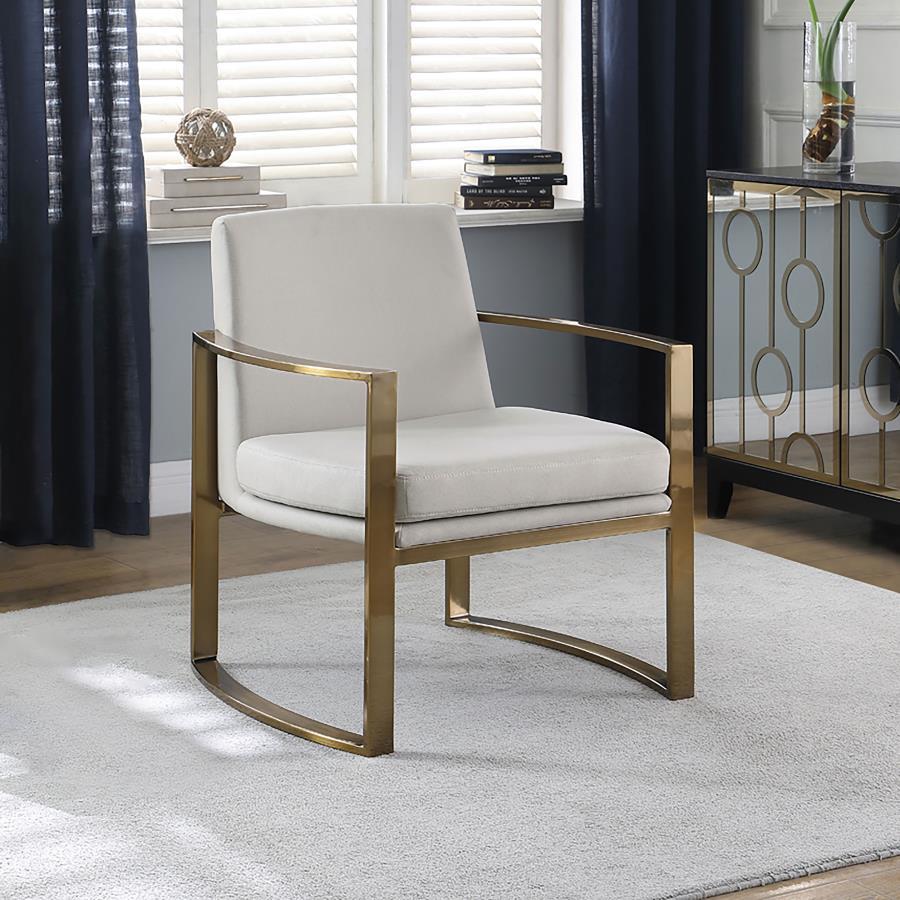 Strikingly modern and pleasing to the eye, this accent chair will perk up your living area. Concave armrests bring a supportive and comfortable seating experience. They boast a brushed bronze finish and add rich curvature to a classic silhouette. Padded c