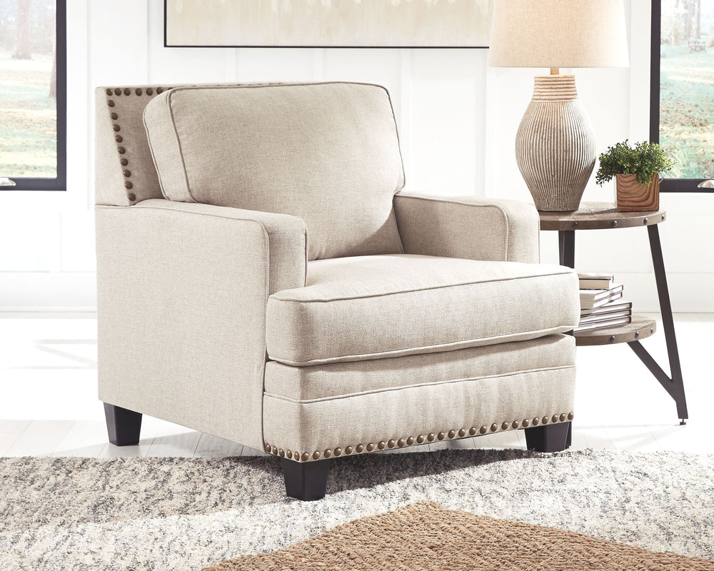 A case of contemporary and classic style influences coming together in a beautiful way, this chair in beige brings a fresh perspective to modern farmhouse living. Distinctive elements include t-cushioning that wraps around setback track arms, nailhead tri