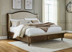  inviting and beautifully in the moment. Case in point: this king upholstered panel bed. The alluring piece features a distinctive headboard with a shelter wing design. Its cushioned bench fo