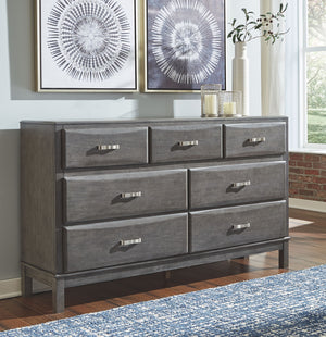  the dresserâ€™s contoured drawers offer ample storage options. Sporting a distinctive weathered gray 