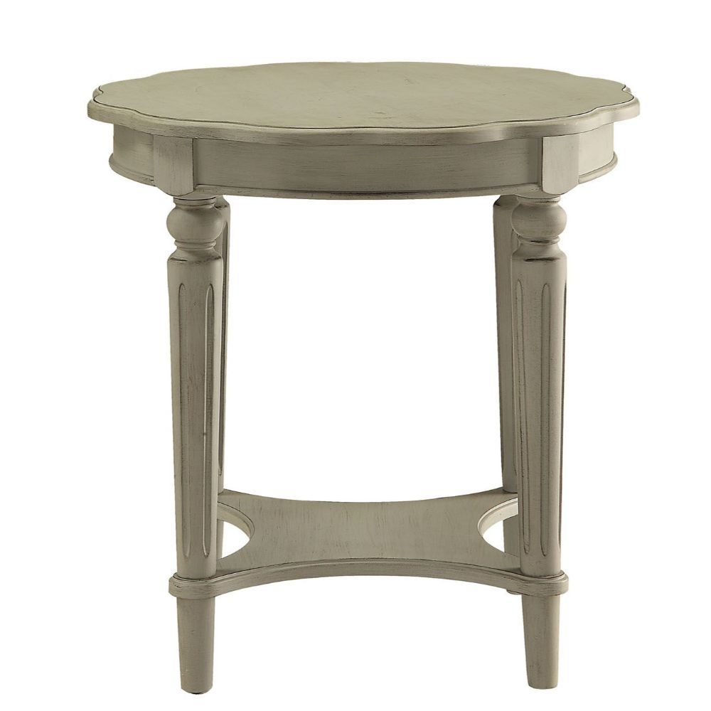 The French country-inspired Fordon occasional table is gracefully designed and made from quality materials. Scalloped round table top, turned legs and a bottom shelf, each piece is carefully crafted while superb functionality is kept in mind. This occasio