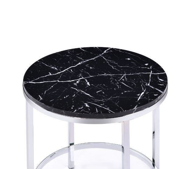 Infuse your small space with big style. The end table combines modern flair with functional design. Table metal frame in a chrome finish exudes lustrous shine, topped with faux black marble that boasts brilliant reflective properties. There is a tempered 