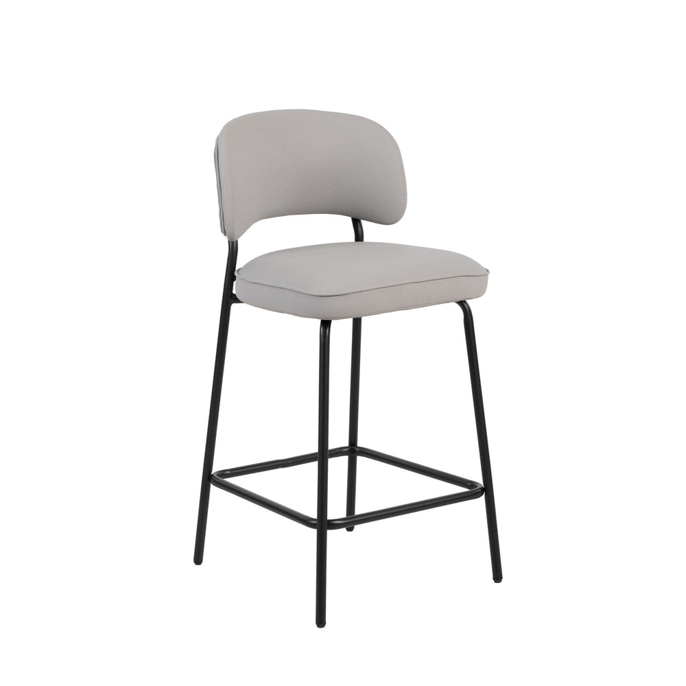 The Blythe Ivory Faux Leather Counter Chair set combines modern design with practical comfort, perfect for enhancing any contemporary space. Each set includes two counter-height chairs with a sleek, arched back and low profile for a refined look. The ivor