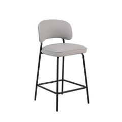 The Blythe Ivory Faux Leather Counter Chair set combines modern design with practical comfort, perfect for enhancing any contemporary space. Each set includes two counter-height chairs with a sleek, arched back and low profile for a refined look. The ivor