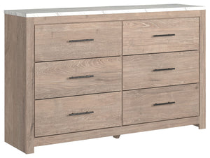 Cool, clean and casually modern. This dresserâ€™s light natural finish and faux Calcutta marble top set the tone for your calming sanctuary. Large linear pulls add dimension and authenticity. Six smooth-gliding drawers neatly accommodate your wardrobe nee