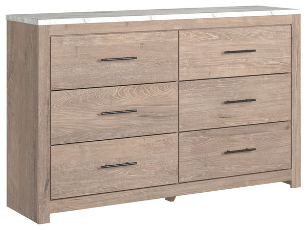 Cool, clean and casually modern. This dresserâ€™s light natural finish and faux Calcutta marble top set the tone for your calming sanctuary. Large linear pulls add dimension and authenticity. Six smooth-gliding drawers neatly accommodate your wardrobe nee