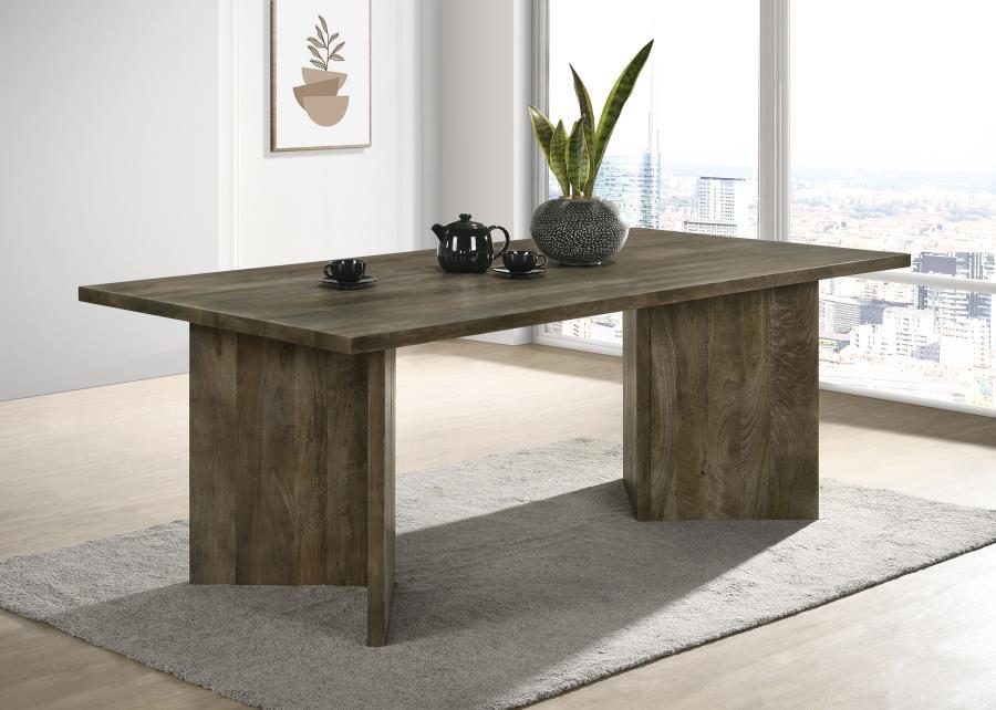 Introduce a modern and eco-friendly statement piece to your dining room with this exquisite mango wood dining table. Crafted from sustainable mango wood, it showcases a sharp V-shaped base and an architectural silhouette that adds a touch of contemporary 