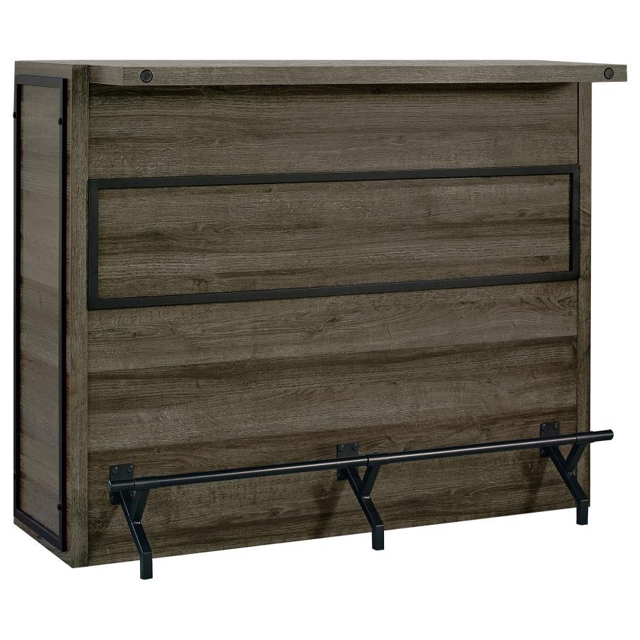 Serve up smile after smile at your next gathering of guests. This handsome, wooden bar unit boasts a bold, rustic design to enliven your space. Five roomy shelves with stemware racks provide plenty of space for your party essentials. A metal footrest is a