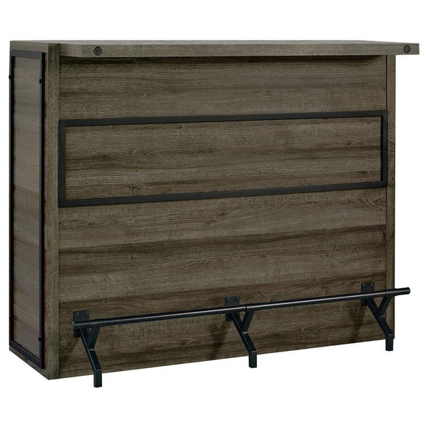 Serve up smile after smile at your next gathering of guests. This handsome, wooden bar unit boasts a bold, rustic design to enliven your space. Five roomy shelves with stemware racks provide plenty of space for your party essentials. A metal footrest is a