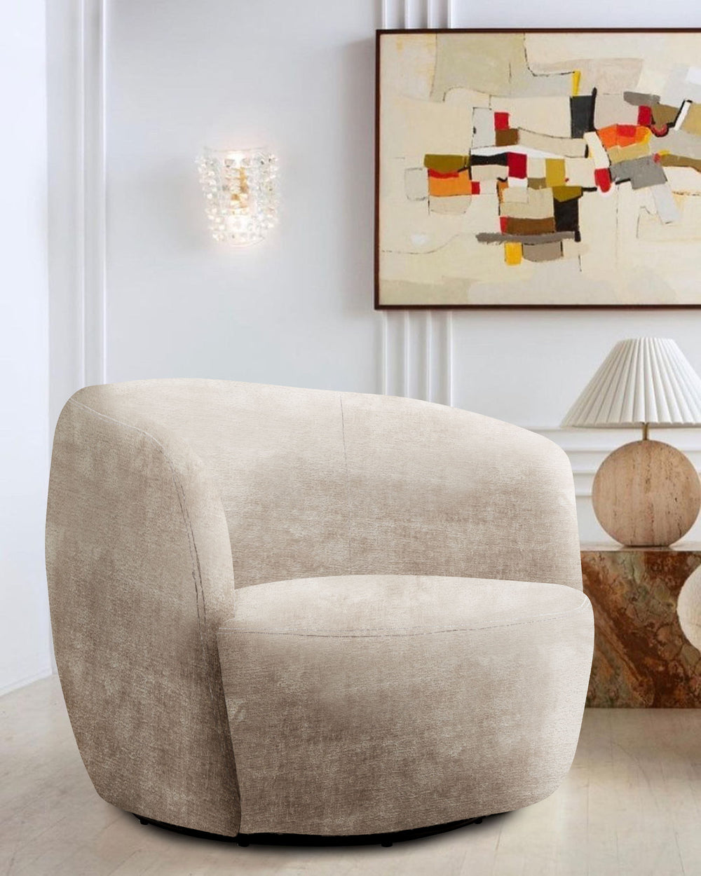 This swiveling accent chair updates your living room with a playful, modern look. It-'s made with a kiln-dried solid pine wood frame with a streamlined barrel silhouette. The design features a curved back with foam padding and a seat bolstered with sinuou