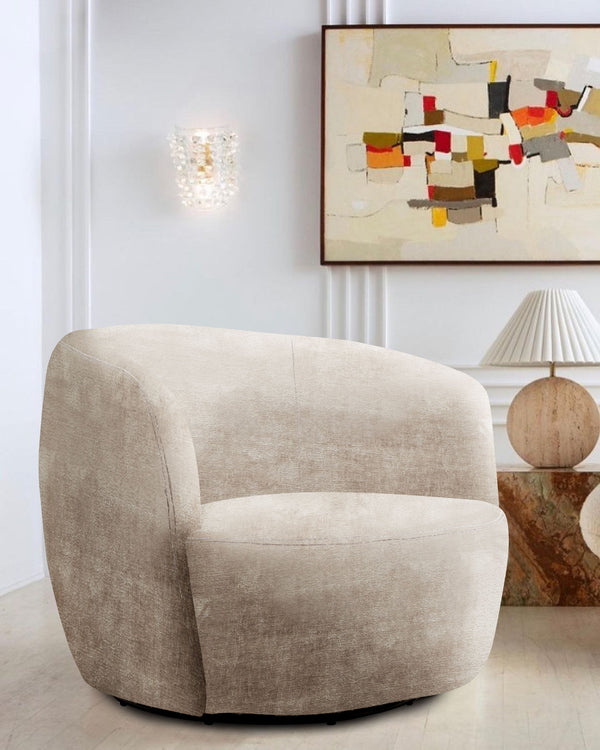 This swiveling accent chair updates your living room with a playful, modern look. It-'s made with a kiln-dried solid pine wood frame with a streamlined barrel silhouette. The design features a curved back with foam padding and a seat bolstered with sinuou