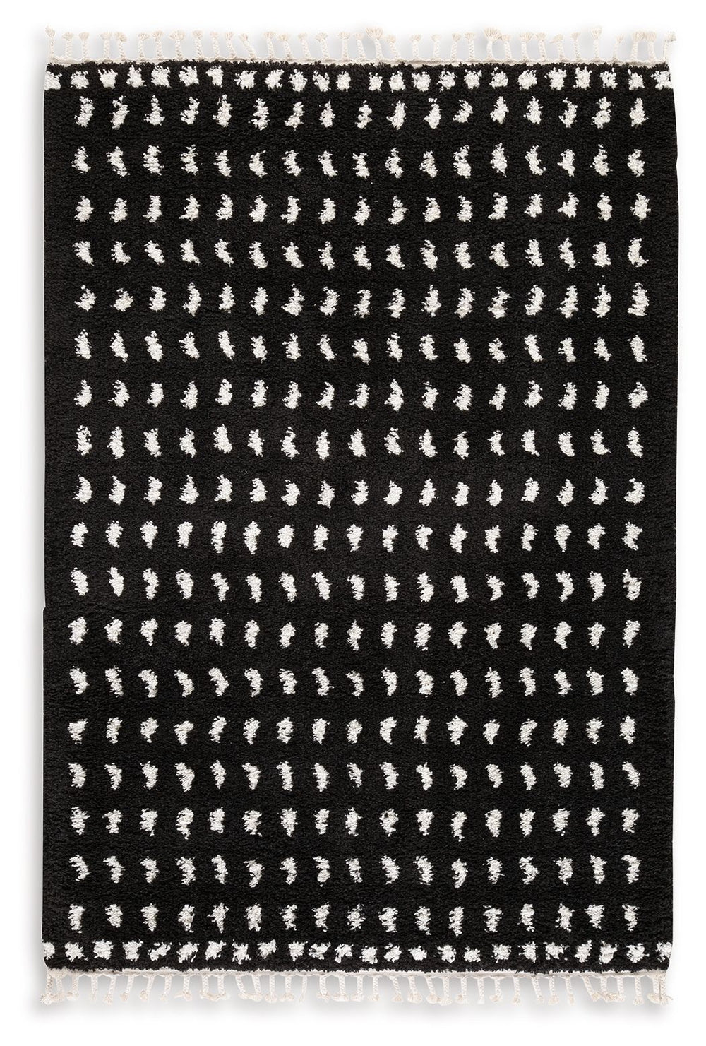 Sink your feet into this modern area rug. Offering a luxurious shag with woven dot design in black and white, this rug adds sophistication to any space without sacrificing comfort or durability. Finished with a braided tassel edge completing the design, t