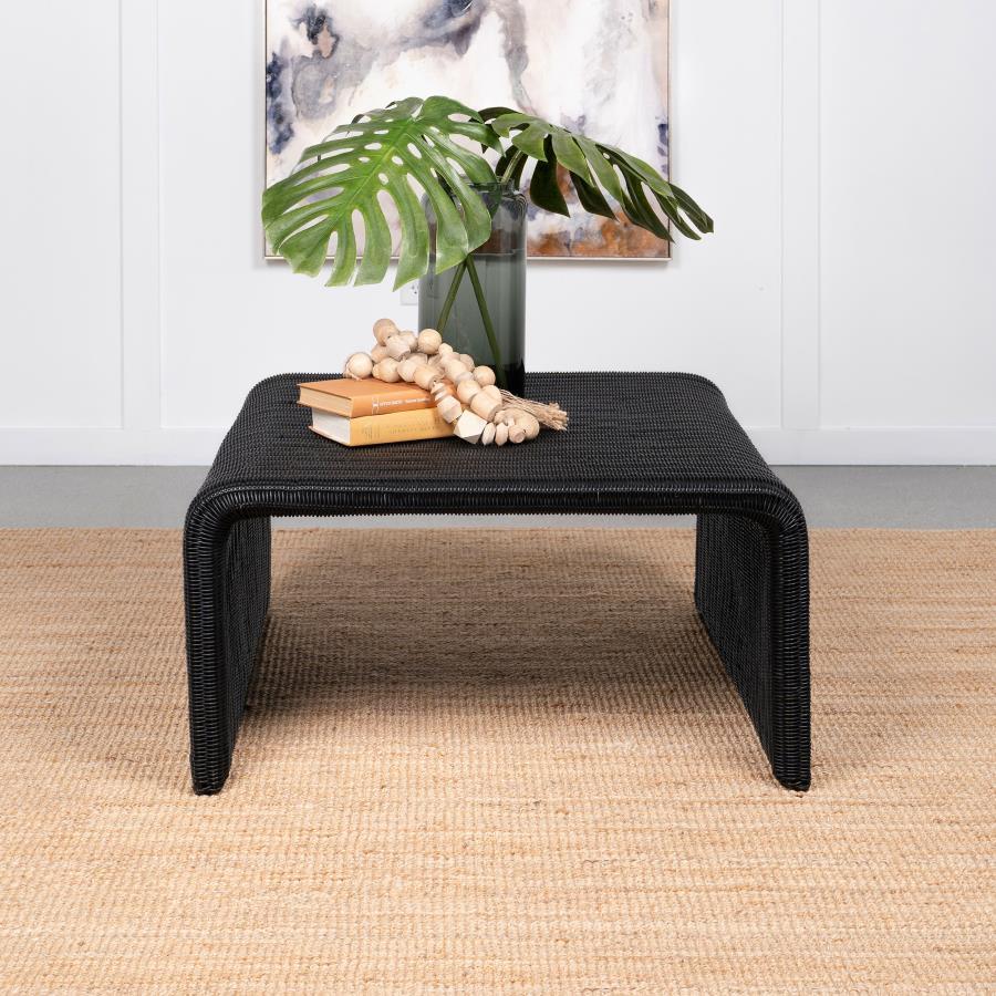 Repurpose the retro feel of a classic design as you choose pieces to outfit a casual space. This coffee table features a minimalist inverted U-shape silhouette revisits 1970s furniture style and serves its purpose well. Made of black metal with a woven su