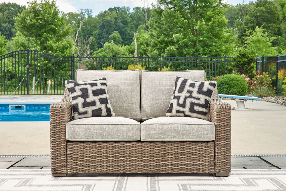 Sporting an easy-on-the-eyes look inspired by driftwood, this loveseat elevates the art of alfresco living. Beautiful and durable enough for indoor and outdoor use, the high-style/low-maintenance seating entices with plush removable cushions wrapped in Nu