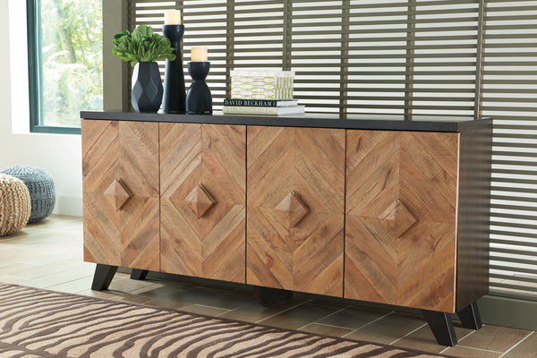 brilliant statement with this 4-door accent cabinet. Its two-tone styling merges a dark brown exterior with a multi-tonal distressed finish on the doors and handles. A diamond-shaped plank effect brings rich