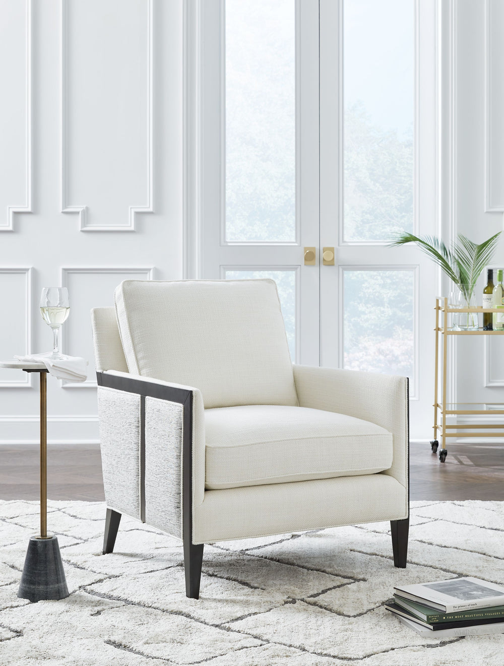 This accent chair completes your lounge area in chic, contemporary style. Itâ€™s a fashion-forward take on geometric patterns, with the exterior fabric in varying neutral hues contrasting the ivory seat. With this chair, your trendy interior is upgraded w