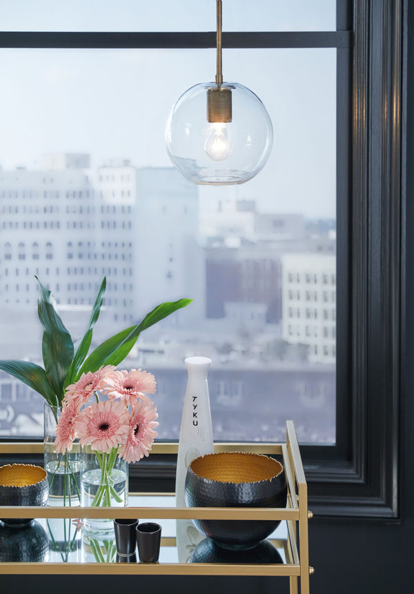  this glass pendant light puts everything on display in a beautiful way. Be it over a table or in an entryway