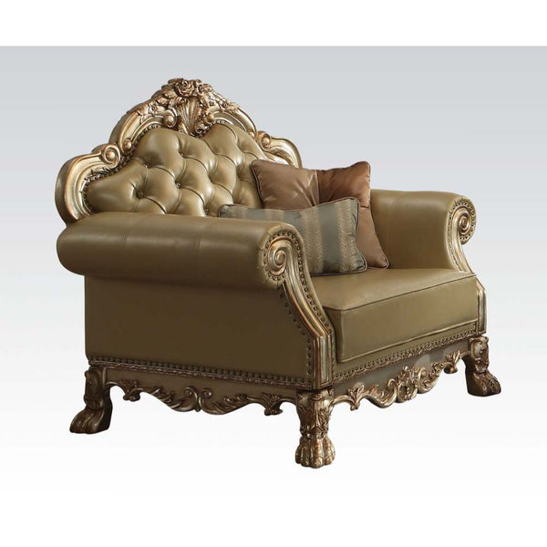 The Dresden gold patina and bone faux leather chair has a traditional feel, featuring decorative carvings, inlay veneer ball and claw feet and hand brushed gold accents. The seat and back have a faux leather button tufted cushion with Nailhead trim. Comes