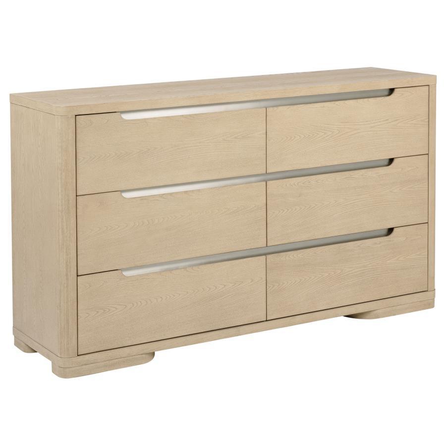 This contemporary six-drawer dresser is designed with clean lines and a light elm finish to complement modern spaces. Brushed nickel fingertip pulls and rounded corners add subtle refinement. The extra-large drawers feature tinted interiors, French doveta
