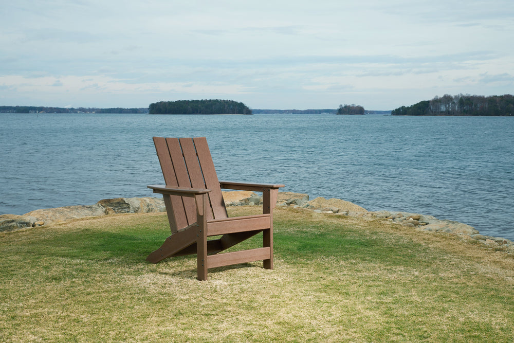 Add cottage-quaint charm to your outdoor oasis with this Adirondack chair. Made of MEGA-TUFFÂ® high-density polyethylene material, this chair is sure to weather the seasons beautifully. The slatted styling, designed to shed rainwater, provides exceptional