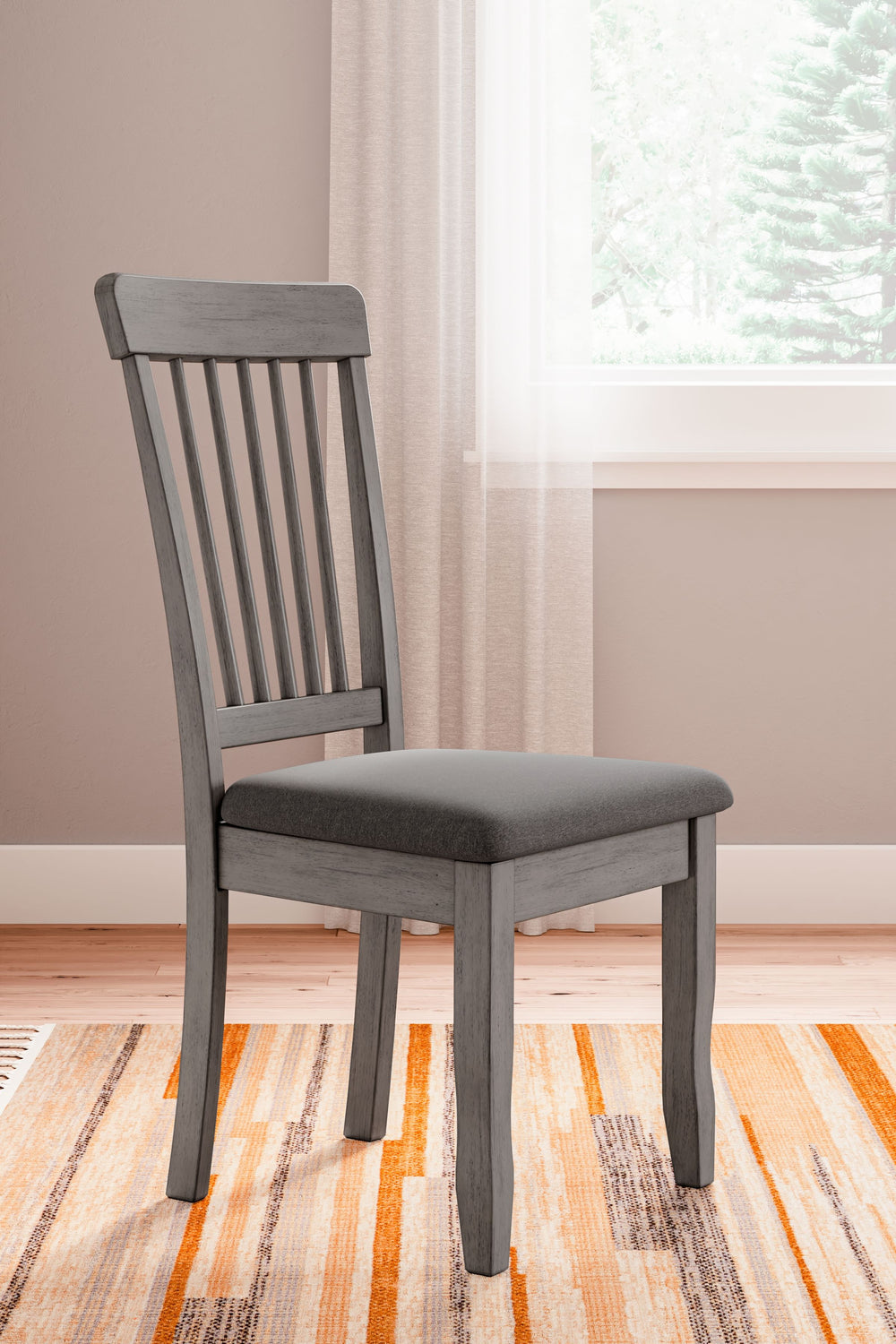 Serve up casual elegance with this dining chair. Its approachable character ushers a relaxed feel into kitchen nooks and small dining rooms. Design details like a spindle back elevate the look, with contrasting gray hues lending a monochromatic, modern ed
