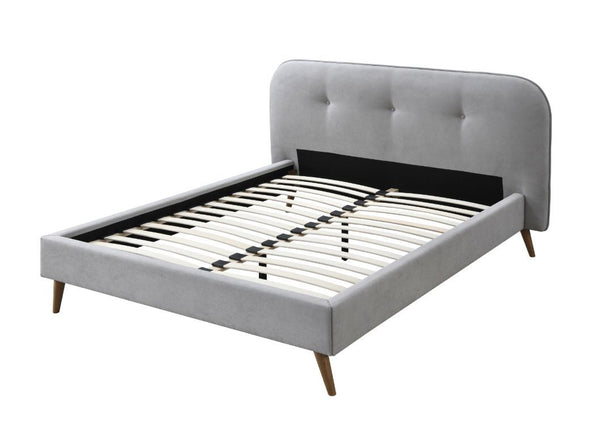 Unexpected gray tone paired with natural wood accents creates a relaxing sleep environment for you. The fully upholstered bed features a button-tufted headboard for a comfortable spot to lean on. Gray fabric upholstery fills the bed with a stunning textur