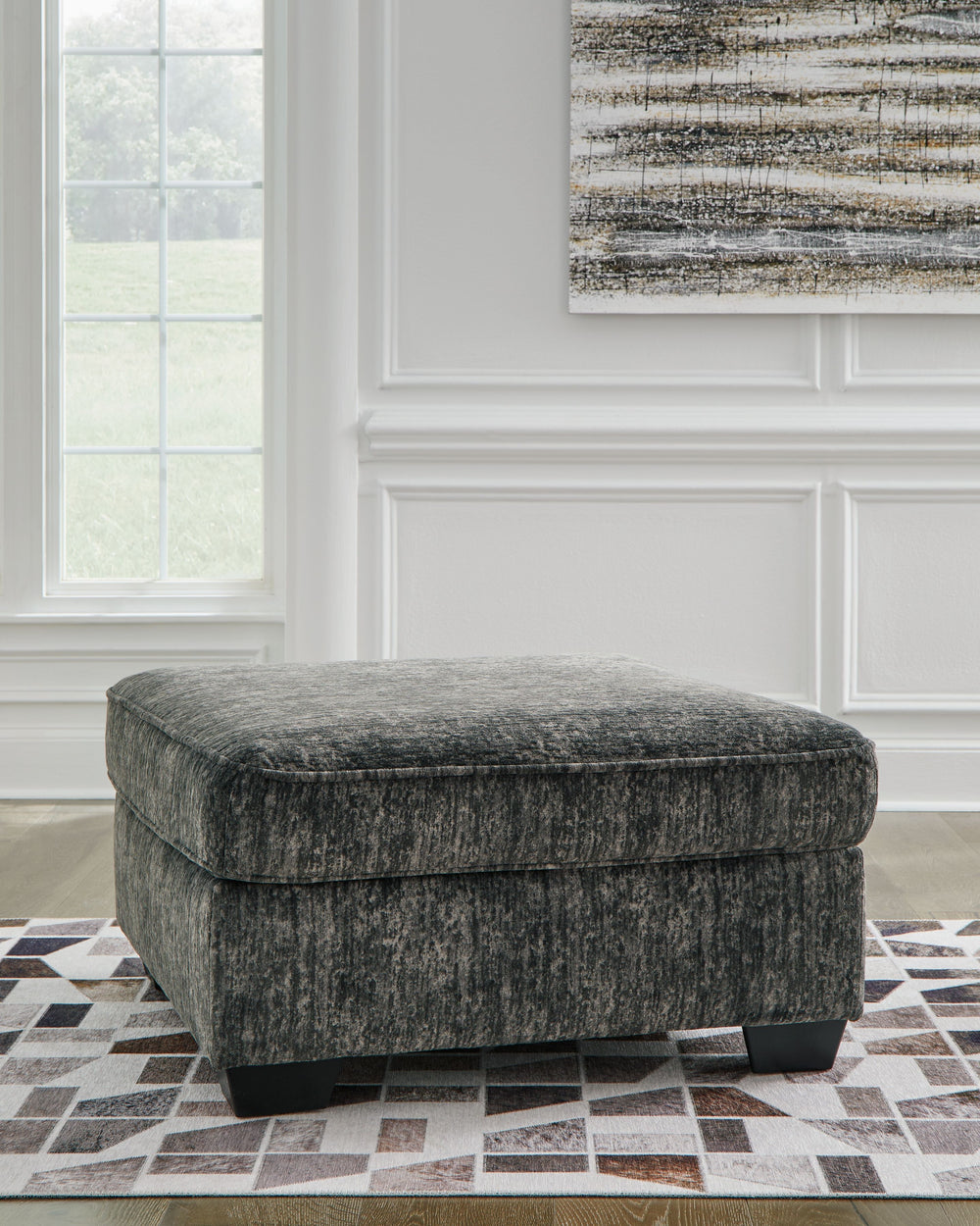 This oversized ottoman speaks to those drawn to fresh, contemporary style with richly neutral appeal. The footrest-'s generous size invites everyone to delight in its comfort. Subtle and sophisticated, the plush upholstery and dark tri-block legs are a na