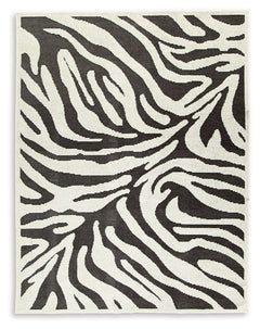 Cover your floor in safari vibes. A bold zebra design on this area rug brings a bit of rugged chic to any room. Machine washable for easy maintenance, the contemporary statement piece knows no boundaries.<br/><br/><b>Product Features</b><ul><li>Made of po