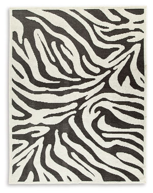 Cover your floor in safari vibes. A bold zebra design on this area rug brings a bit of rugged chic to any room. Machine washable for easy maintenance, the contemporary statement piece knows no boundaries.<br/><br/><b>Product Features</b><ul><li>Made of po