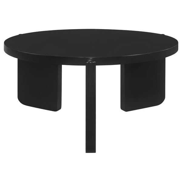 The coffee table, a focal point in your living area, is both a gathering place and a showcase of solid wood artistry. Its circular form softens spaces, inviting conversation and connection. The substantial silhouette of this cocktail table speaks of its r