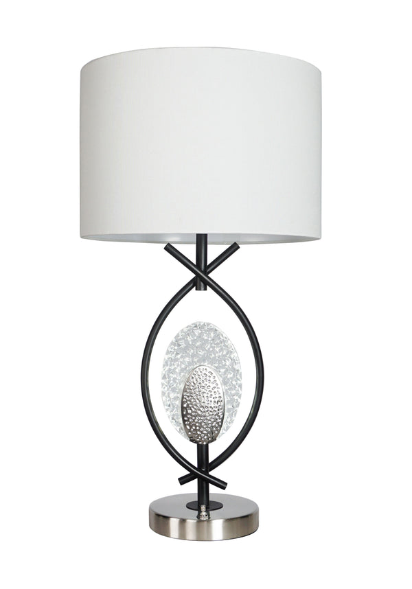 Elevate your decor with a striking combination of modern artistry and functional elegance. This exquisite table lamp showcases a unique intertwining metal frame that exudes sophistication and visual intrigue. At its heart, a sparkling crystal accent and t