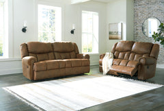 Expansive elegance. This set makes a sizable style statement. Its large scale enhances the luxe appearance, magnifying the beauty of richly warm brown faux leather. Polishing off the piece is one-touch power reclining, which adds a layer of function to th