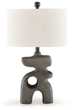 This striking table lamp is an enlightening choice for those with an eye for contemporary design. A free-flowing base and sleek oval shade elevate this piece to a simply illuminating art form. Place it anywhere you need an infusion of sophisticated style.