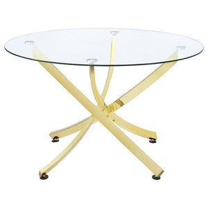 This round dining table offers a striking balance of clarity and form. A clear tempered glass top creates an airy presence, while the sculptural asterisk-style base adds dramatic visual interest. Crafted from heavy gauge metal, the base is electroplated i