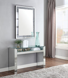The Nysa Sofa Table will add a contemporary touch to any room in your home. With its clean lines, this brilliant rectangular occasional table showcases a distinctive style for an intriguing look. The table features a fully mirrored sled base with an exqui