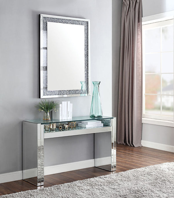 The Nysa Sofa Table will add a contemporary touch to any room in your home. With its clean lines, this brilliant rectangular occasional table showcases a distinctive style for an intriguing look. The table features a fully mirrored sled base with an exqui